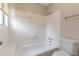 Bright and white bathroom with tiled walls and floors at 1575 Kelleys Close, Stone Mountain, GA 30088