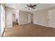 Large bedroom with carpet and access to bathroom at 1575 Kelleys Close, Stone Mountain, GA 30088