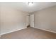 The bedroom features neutral walls, carpet, and a ceiling light for a calm, inviting atmosphere at 1575 Kelleys Close, Stone Mountain, GA 30088