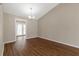 Bright dining room featuring hardwood floors, neutral paint, and access to the backyard at 1575 Kelleys Close, Stone Mountain, GA 30088