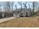 Residential house with attractive curb appeal and a well-kept front yard at 1575 Kelleys Close, Stone Mountain, GA 30088