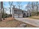 View of the house showcasing the two-car garage and inviting facade at 1575 Kelleys Close, Stone Mountain, GA 30088