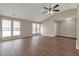 Spacious living room featuring hardwood floors, vaulted ceilings, and large windows at 1575 Kelleys Close, Stone Mountain, GA 30088
