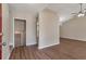 Inviting living room with hardwood floors, vaulted ceiling and neutral wall color at 1575 Kelleys Close, Stone Mountain, GA 30088