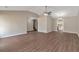 Open-concept living space featuring hardwood floors, neutral paint, and access to other rooms at 1575 Kelleys Close, Stone Mountain, GA 30088