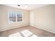Bedroom with a bright window and neutral-colored carpeting at 320 Six Branches Ct, Roswell, GA 30076