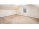 Large bedroom with ample natural light coming in from windows and a dormered ceiling at 320 Six Branches Ct, Roswell, GA 30076