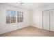 Cozy bedroom with a large window and closet space at 320 Six Branches Ct, Roswell, GA 30076