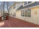 Wooden deck overlooking the backyard with a sliding glass door to the house at 320 Six Branches Ct, Roswell, GA 30076