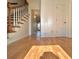 Entryway featuring hardwood floors, stairs, and access to other rooms at 320 Six Branches Ct, Roswell, GA 30076