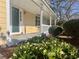 Charming front porch with classic columns and garden, creating a welcoming entrance at 320 Six Branches Ct, Roswell, GA 30076
