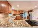 This kitchen boasts granite countertops, stainless steel appliances and tile backsplash at 320 Six Branches Ct, Roswell, GA 30076