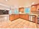 Bright eat-in kitchen featuring granite countertops, stainless appliances, and tile flooring at 320 Six Branches Ct, Roswell, GA 30076