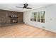 Spacious living room with a brick fireplace and large windows with natural light at 320 Six Branches Ct, Roswell, GA 30076