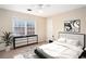 Comfortable main bedroom with natural light, closet, and a ceiling fan at 320 Six Branches Ct, Roswell, GA 30076
