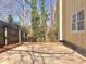 An outdoor patio area features space for entertaining and enjoying the surrounding natural landscape at 320 Six Branches Ct, Roswell, GA 30076