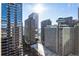 Expansive city view showcases prominent buildings, including Hyatt Regency, set against a bright, sunny sky at 300 Peachtree Ne St # 24F, Atlanta, GA 30308