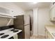 Functional kitchen with essential appliances, ample counter space, and well-maintained cabinets at 300 Peachtree Ne St # 24F, Atlanta, GA 30308