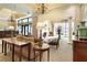 Lobby seating area is complete with patterned sofas, stylish tables, and natural lighting, and chandeliers at 300 Peachtree Ne St # 24F, Atlanta, GA 30308