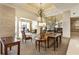 Elegant lobby area features luxurious sofas, statement art, and high ceilings with decorative chandeliers and lamps at 300 Peachtree Ne St # 24F, Atlanta, GA 30308