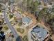 Overhead view of brick house, landscaped yard, mature trees, and cul-de-sac street at 4312 White Hickory Nw Ln, Kennesaw, GA 30152