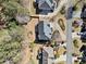 Aerial view of home and landscaped backyard with mature trees and green lawn at 4312 White Hickory Nw Ln, Kennesaw, GA 30152