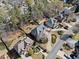 Aerial view of house with landscaped yard, mature trees, and driveway at 4312 White Hickory Nw Ln, Kennesaw, GA 30152