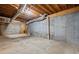 Unfinished basement with exposed wood and concrete walls, perfect for customization and storage at 4312 White Hickory Nw Ln, Kennesaw, GA 30152