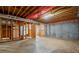 Unfinished basement with exposed framing and utilities, offering potential for renovation at 4312 White Hickory Nw Ln, Kennesaw, GA 30152