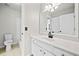 Bathroom featuring white cabinets, quartz countertops, tile flooring, white toilet and a walk-in shower at 4312 White Hickory Nw Ln, Kennesaw, GA 30152