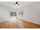 A sunny bedroom with hardwood floors and large windows at 4312 White Hickory Nw Ln, Kennesaw, GA 30152