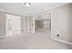 Open bedroom showing two entryways, neutral walls, carpet flooring, crown molding and recessed lighting at 4312 White Hickory Nw Ln, Kennesaw, GA 30152