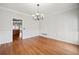 A light-filled dining room with paneled walls and wood floors at 4312 White Hickory Nw Ln, Kennesaw, GA 30152
