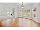 Open dining area adjacent to the living room and featuring wood floors and natural light at 4312 White Hickory Nw Ln, Kennesaw, GA 30152