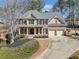 Beautiful two-story brick home with a well-manicured lawn and a spacious two-car garage at 4312 White Hickory Nw Ln, Kennesaw, GA 30152