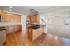 Open concept kitchen with island, stainless appliances, and a view into the living area at 4312 White Hickory Nw Ln, Kennesaw, GA 30152