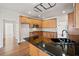 Kitchen with granite countertops, wooden cabinets, and hardwood floors at 4312 White Hickory Nw Ln, Kennesaw, GA 30152