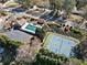 Aerial view of tennis courts, pool and clubhouse surrounded by landscaped greenery at 4312 White Hickory Nw Ln, Kennesaw, GA 30152