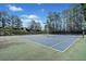 Enjoy a game on the well-maintained community tennis court, surrounded by lush greenery and beautiful trees at 4312 White Hickory Nw Ln, Kennesaw, GA 30152
