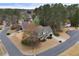An aerial view showcases the landscaped yard and traditional two-story home on a corner lot at 6011 Fairlong Nw Ct, Acworth, GA 30101