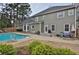 A backyard features a swimming pool and patio area ideal for relaxing and entertaining at 6011 Fairlong Nw Ct, Acworth, GA 30101