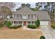 Charming two-story home with a covered front porch and manicured landscaping at 6011 Fairlong Nw Ct, Acworth, GA 30101