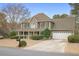 Charming two-story home with a large front porch, manicured lawn, and two-car garage at 6011 Fairlong Nw Ct, Acworth, GA 30101
