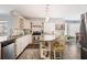 The kitchen features granite countertops, a central island, white cabinets, and stainless steel appliances at 6011 Fairlong Nw Ct, Acworth, GA 30101