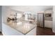 Spacious kitchen with granite countertops, stainless steel appliances, and a center island at 6011 Fairlong Nw Ct, Acworth, GA 30101
