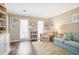 Cozy living room with plush seating, a bookshelf, and ample natural light at 6011 Fairlong Nw Ct, Acworth, GA 30101