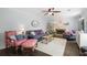 Comfortable living room with a fireplace, hardwood floors, and stylish decor at 6011 Fairlong Nw Ct, Acworth, GA 30101