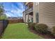 Spacious back yard with well-maintained lawn, privacy fence, and a second story porch at 1803 Stone Bridge Way, Marietta, GA 30064