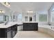 Bright bathroom with double vanity, granite countertops, soaking tub, and natural light at 1803 Stone Bridge Way, Marietta, GA 30064