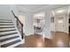 Inviting entryway with hardwood floors, staircase, and a view into the elegant dining room at 1803 Stone Bridge Way, Marietta, GA 30064